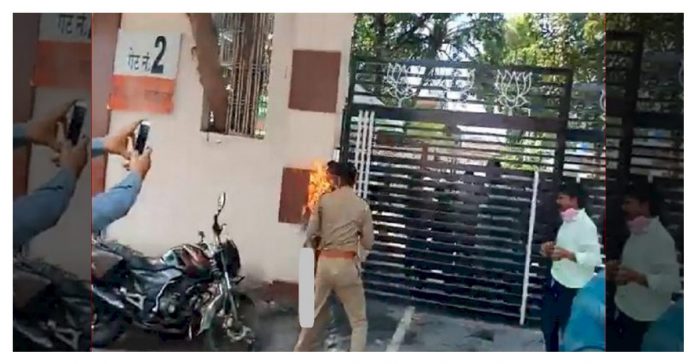 Woman tried to burn herself outside BJP office